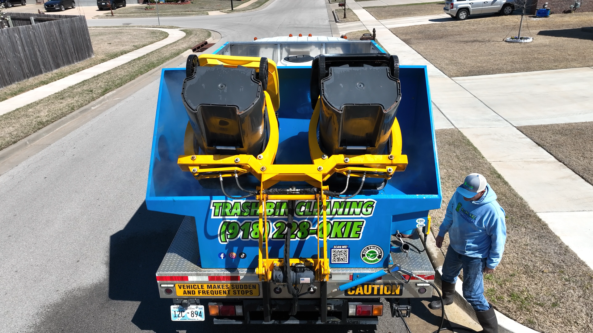 An image of the okie bin cleaners truck while performing a bin cleaning service