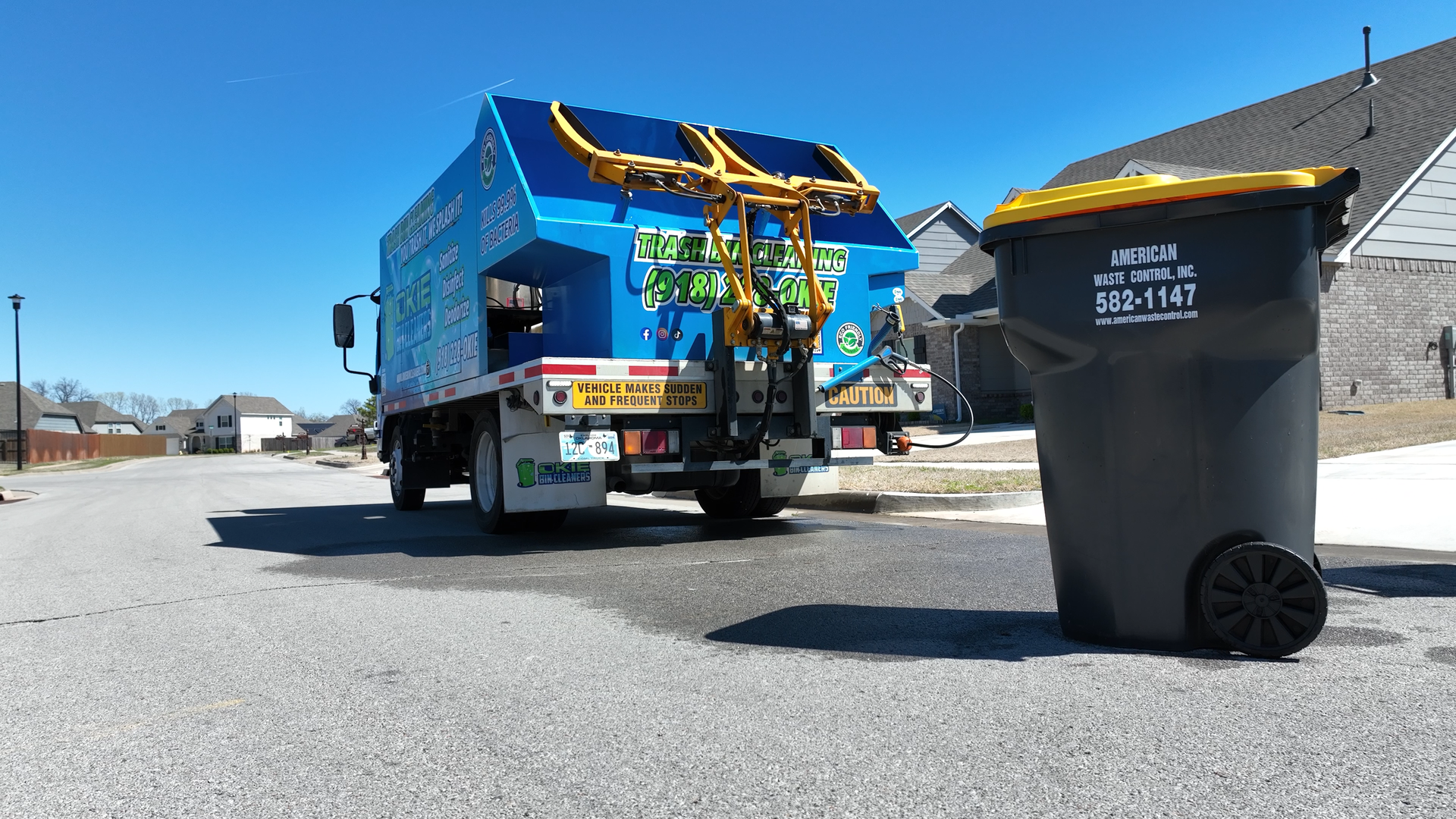 Okie Bin Cleaners Truck 5 - Okie Bin Cleaners An image of the okie bin cleaners truck while performing a bin cleaning service